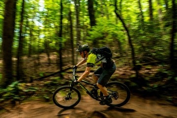 A mountain biker swoops through Pisgah National Forest.