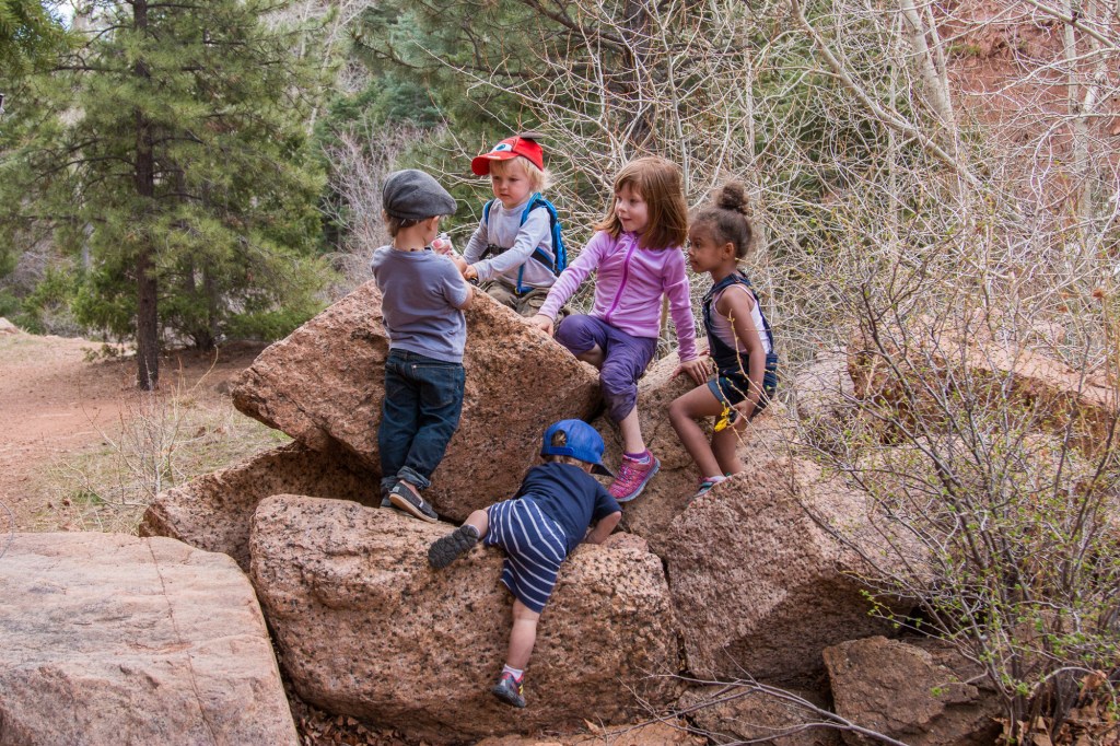 Children play on a rock in the outdoors