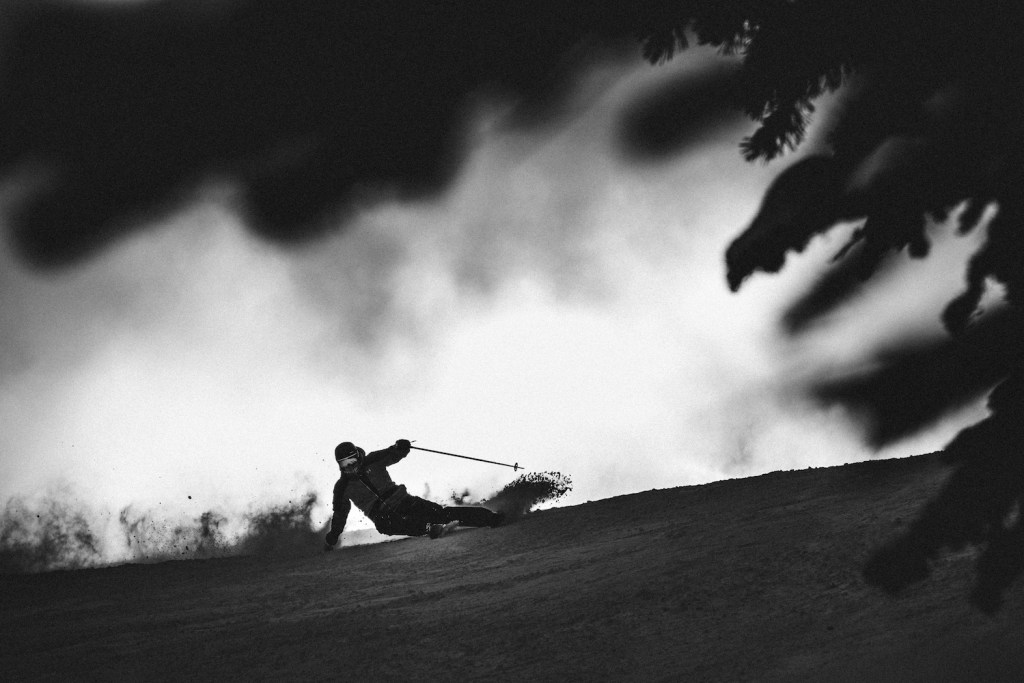 A skier carves groomers on Nordica's mid-fat skis.