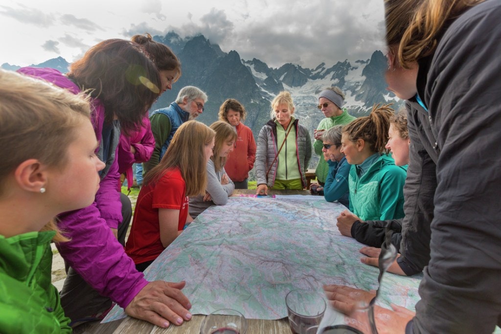 An REI Adventures guide briefs her group about the days' route. 