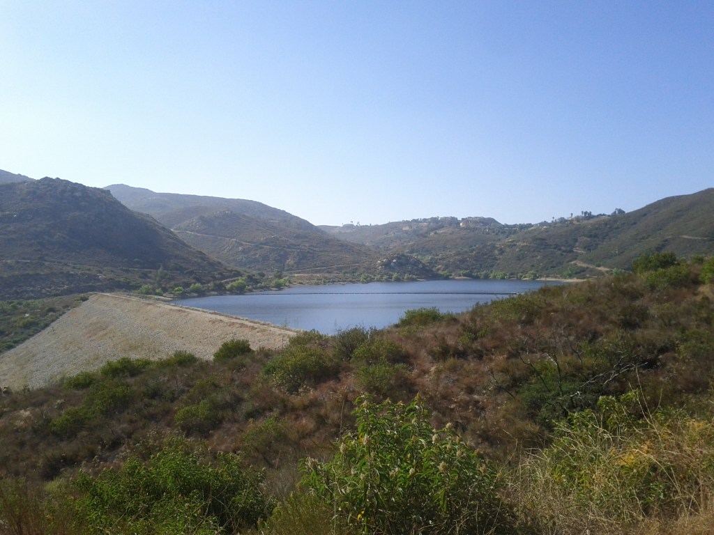 View of a lake and rocky hills.