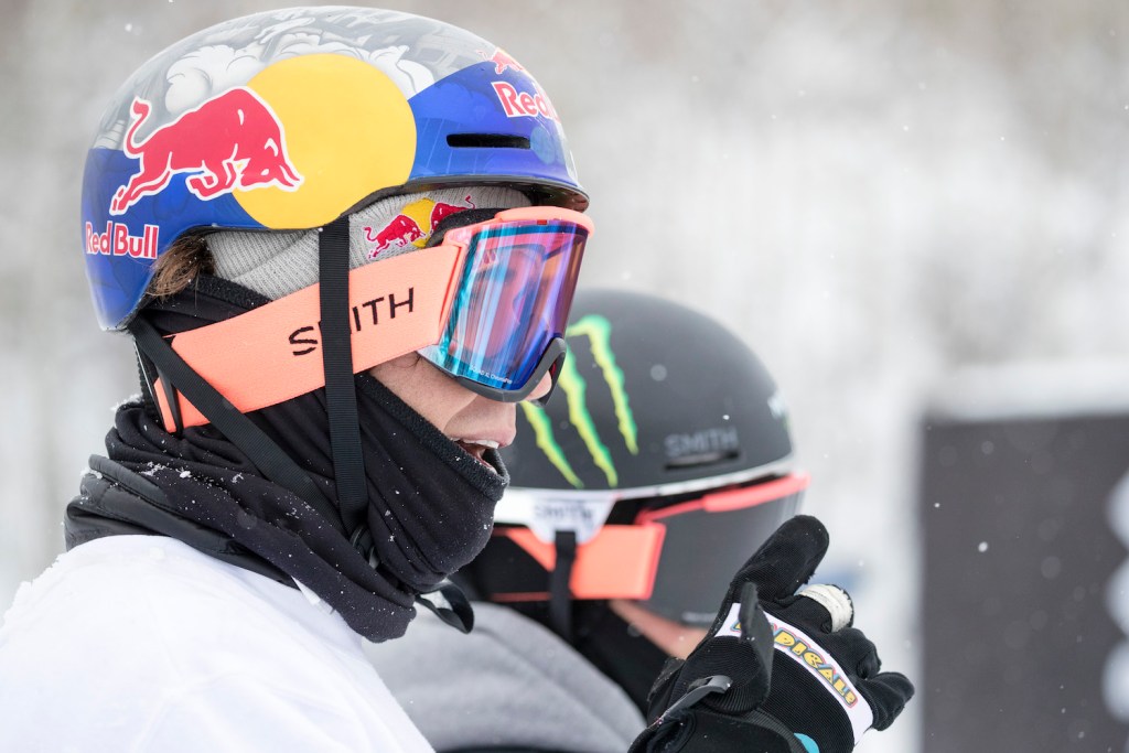 Skiers Bobby Brown and Gus Kenworthy stand next to each other on top of a slopestyle course. 
