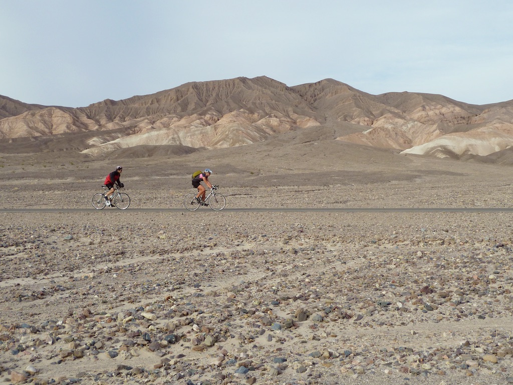 Cyclists on an REI Adventures trip cycle down one of the many isolated roads in Death Valley National Park.