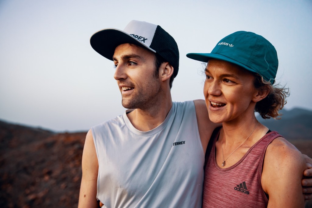 Ultrarunners Cordis Hall and Abby Mitchell on a narrow ridge.