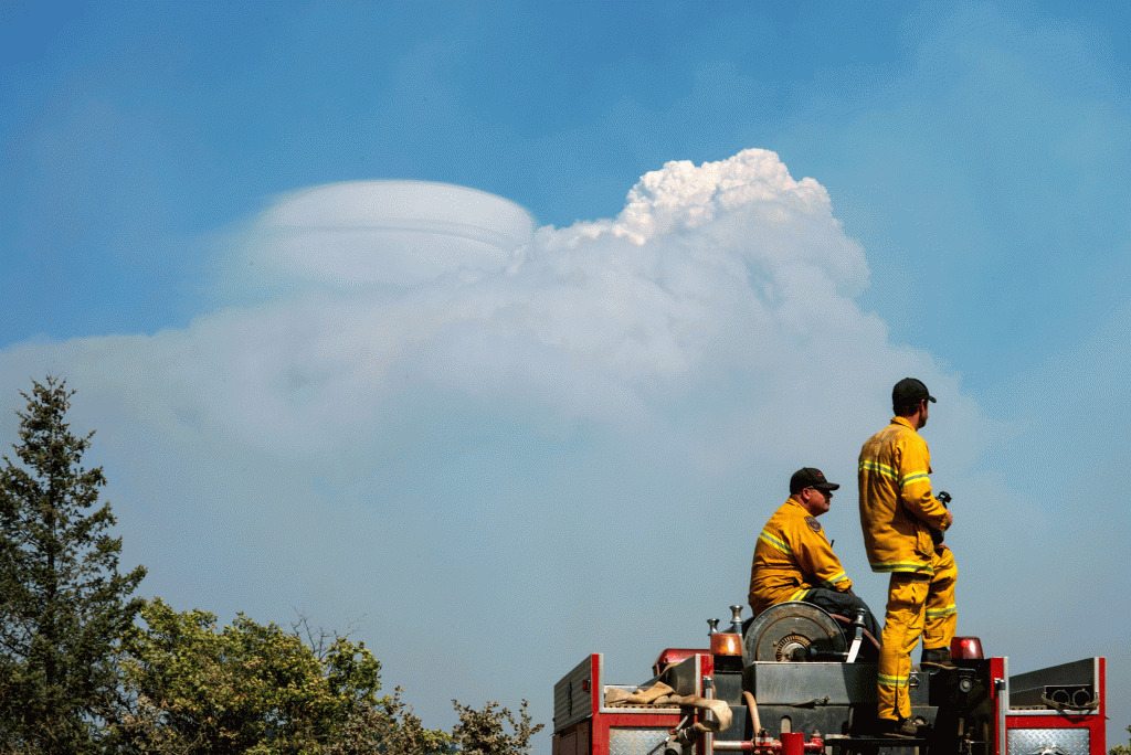 Firefighters monitor fires and smoke columns during the Mendocino National Forest, Calif. in 2018. 