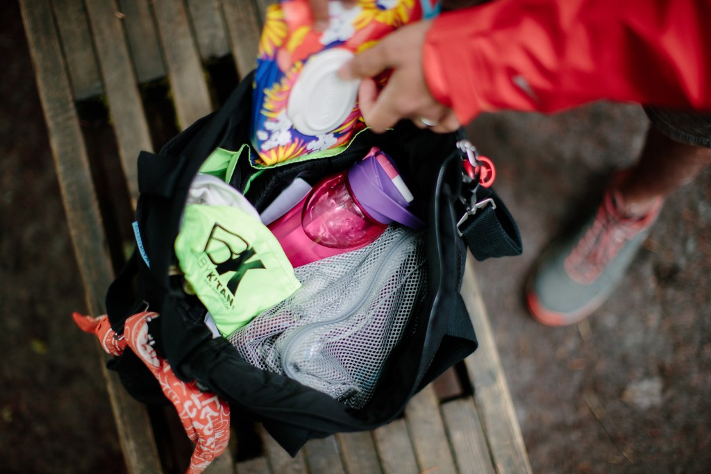 An open diaper bag showing all of the essentials parents may need
