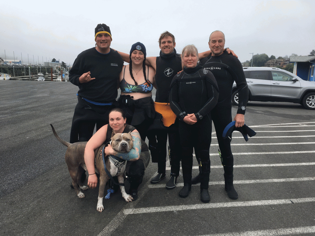 Divers pause for a photo after a dive
