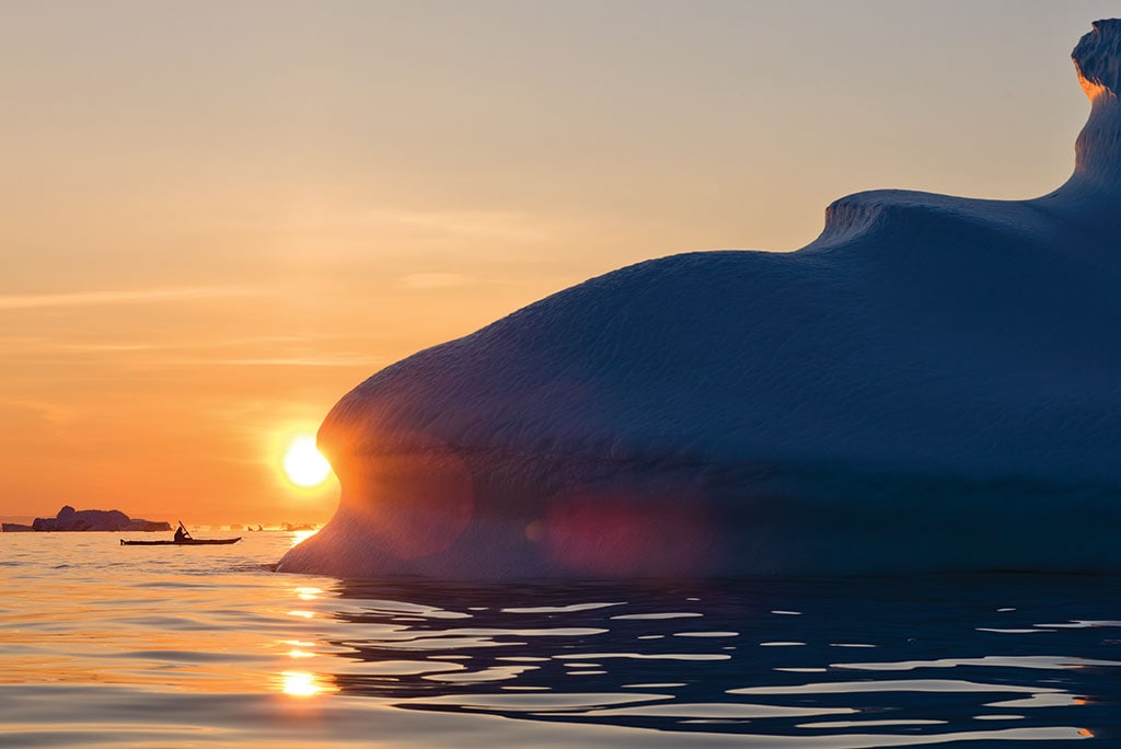 Kayaker paddling in Illuissat, Greenland