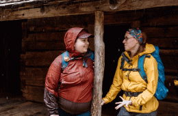 Two women have an in-depth conversation in the rain