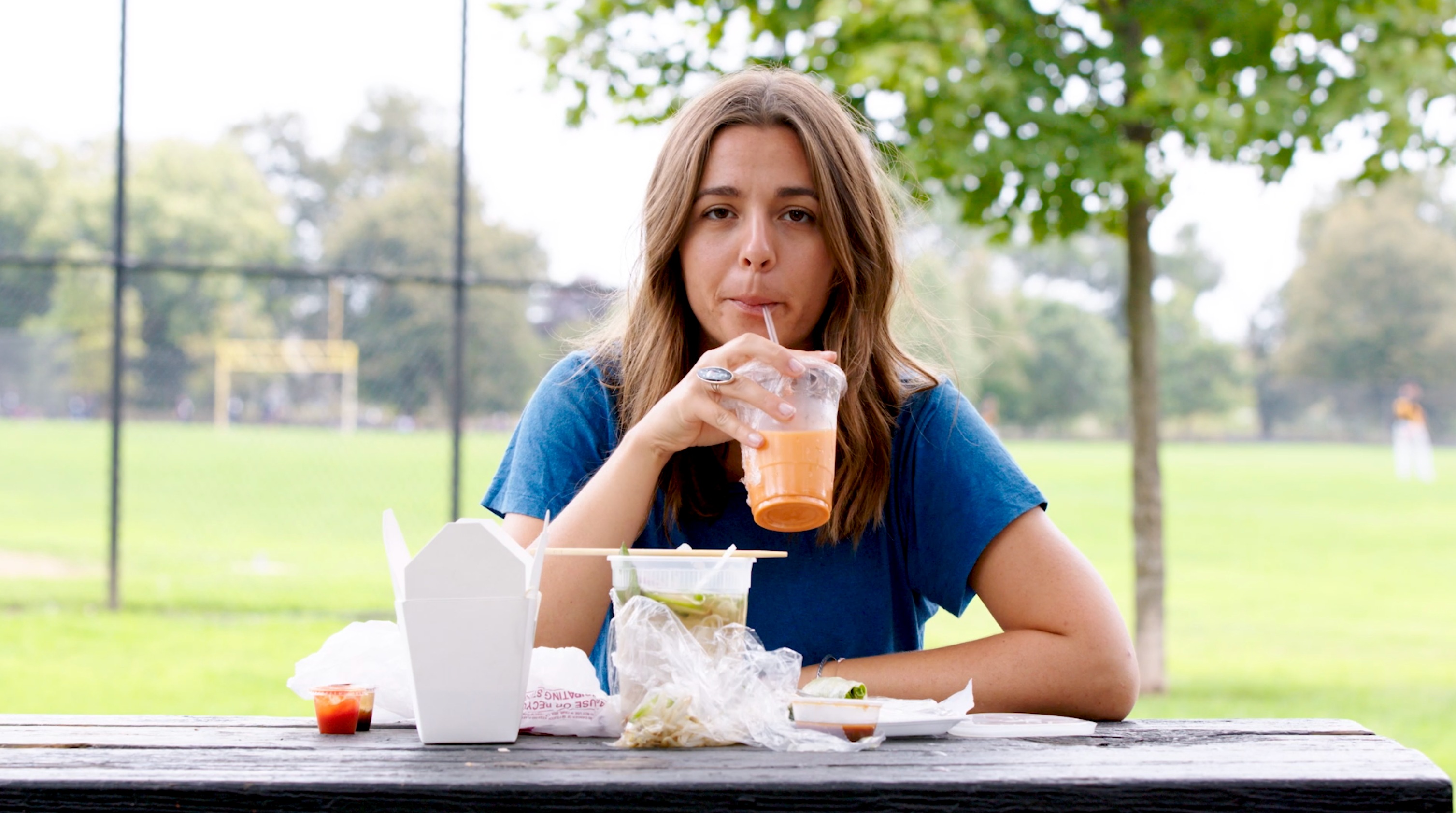 Erin Sullivan eating lunch, astounded by how much single-plastic is part of the meal