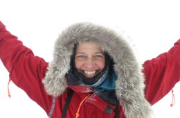 Chris Fagan smiling at the camera in a red parka.