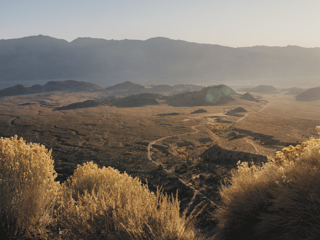 A road snakes through an alpine valley in California