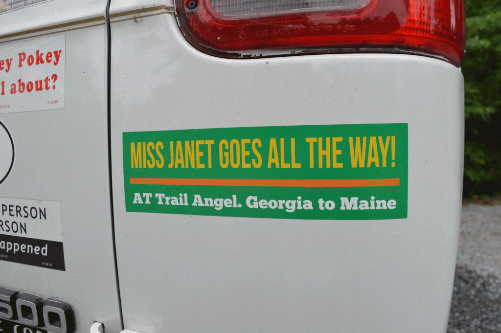 The back of Miss Janet's van with a bumper sticker on it