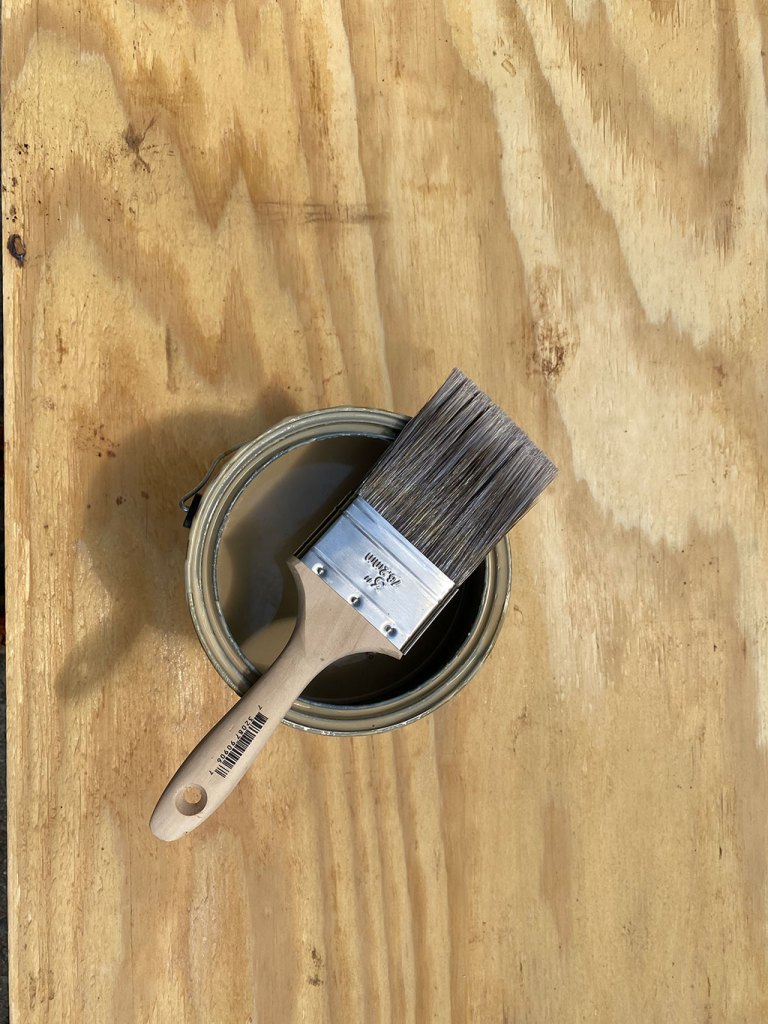 Paintbrush and paint can