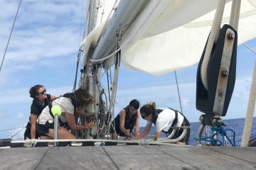 Members of the crew sailing aboard the eXXpedition