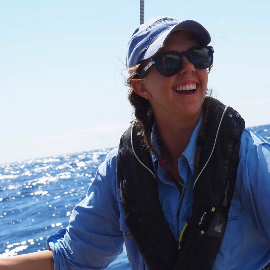Woman sailing on voyage in Pacific Ocean.