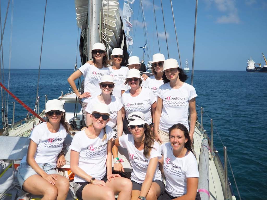 Women aboard a sailboat.