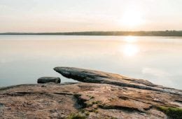 Sun setting over lake