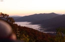 Hikers looking out over a river valley