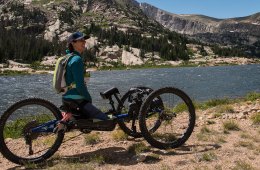 Quinn Brett enjoys a reflective mountain panorama at Lawn Lake