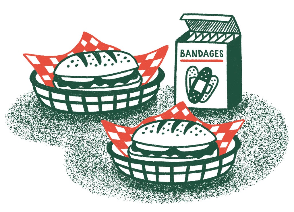 Two sandwiches and a box of bandages