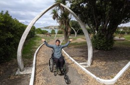 Woman posing in wheelchair.