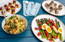 A buffet of outdoor dishes made with fresh fruits and veggies