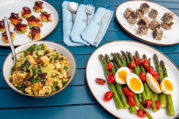 A buffet of outdoor dishes made with fresh fruits and veggies