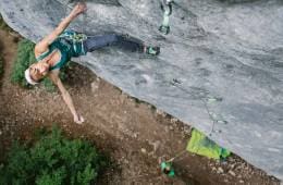 Rock climber midway up rock face