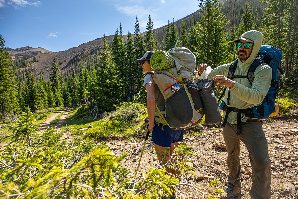 Two backpackers on a trail