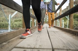 Photo of people walking across a bridge.