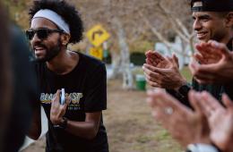 A group of runners from BlacklistLA cheer on their teammates