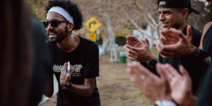 A group of runners from BlacklistLA cheer on their teammates