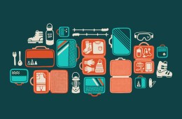 Illustration of gear laydown, with packing cubes and various pieces of gear.