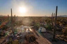 Photo of people car camping in a desert.