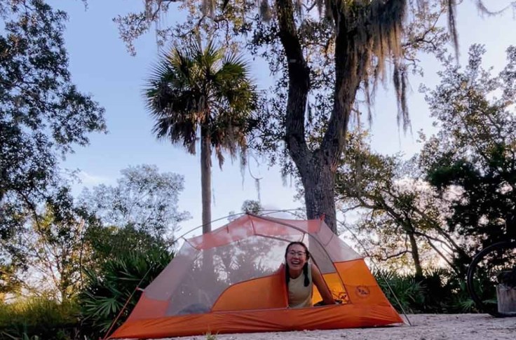 Regina Yan in a tent along her East Coast Greenway journey.