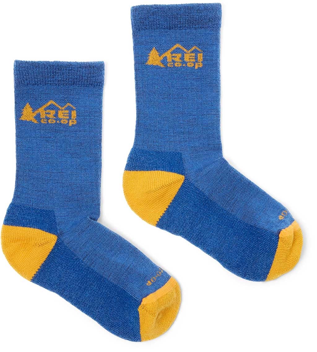 A pair of blue REI Co-op Trailsmith Merino Wool Lightweight Crew Socks with yellow heels and toes.