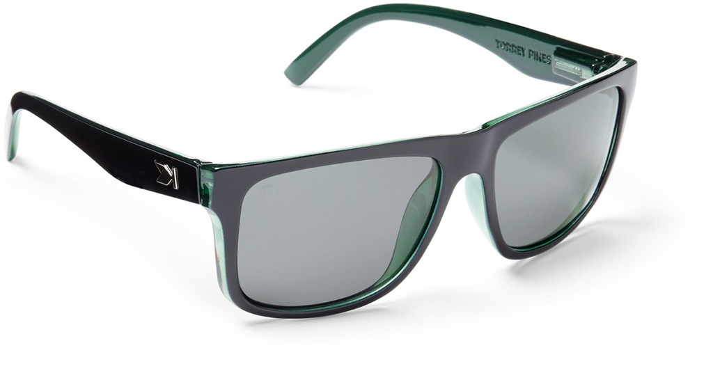 A pair of black sunglasses with dark gray lenses against a white background