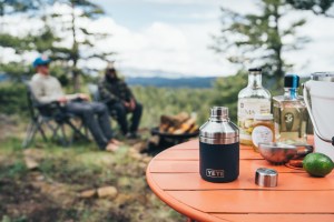 Image of several spirits on a camp table.