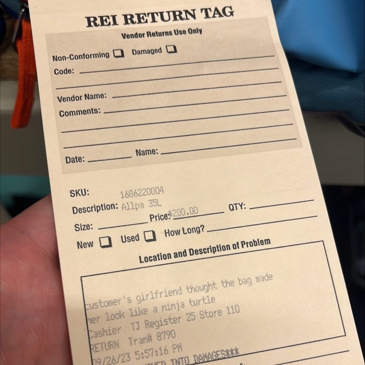 Photo of a return tag that reads, "customer's girlfriend thought the bag made her look like a ninja turtle"