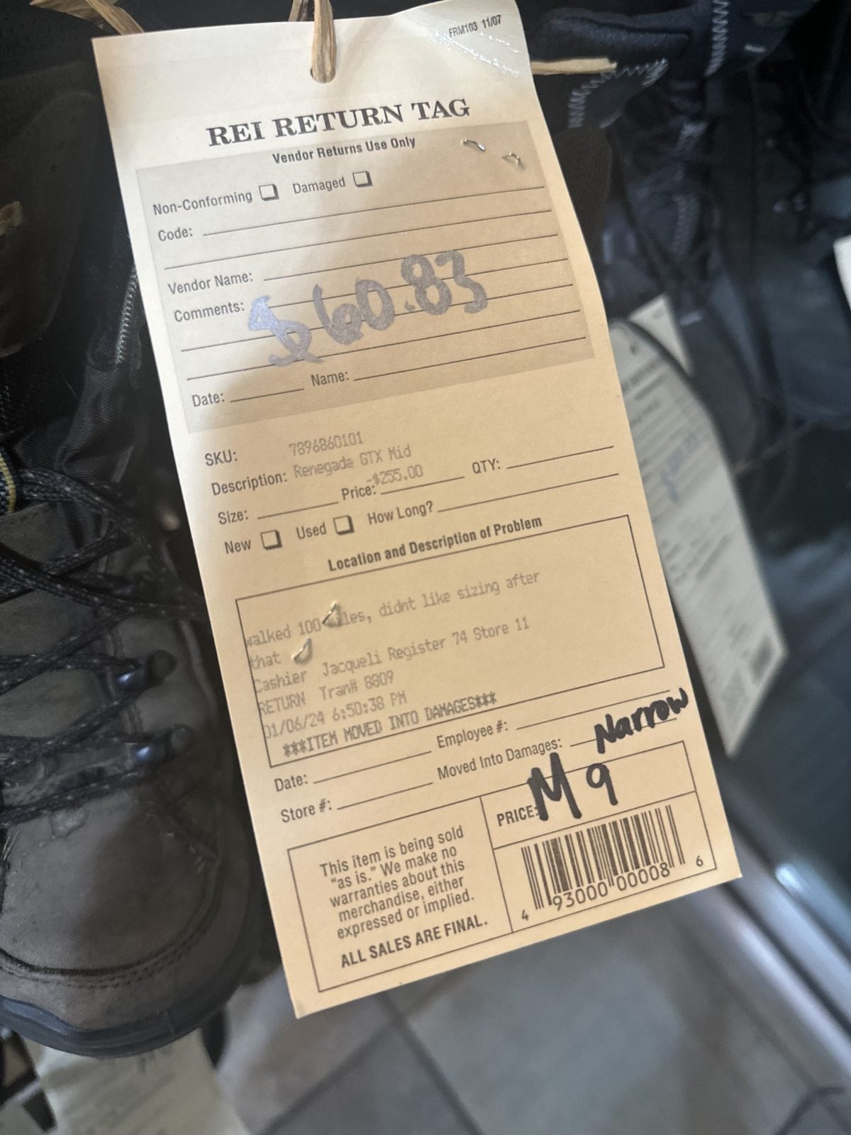 Photo of an REI return tag that reads, "walked 100 miles, didn't like sizing after that."