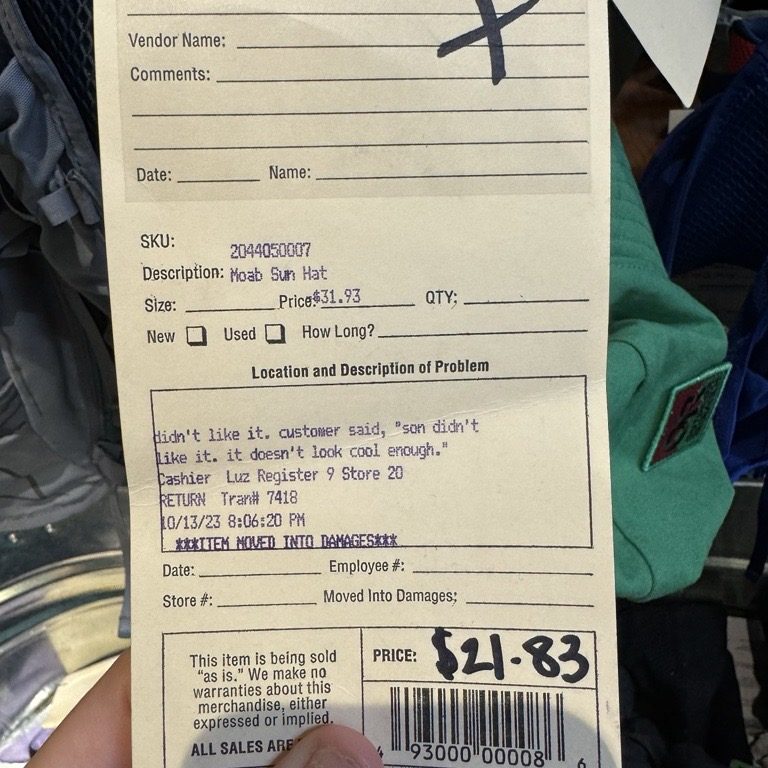 Photo of a return tag that reads, "didn't like it. customer said, 'son didn't like it. it doesn't look cool enough.'"