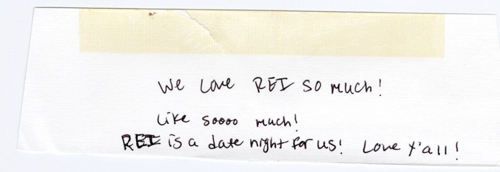 A handwritten note with a piece of masking tape at the top of it.