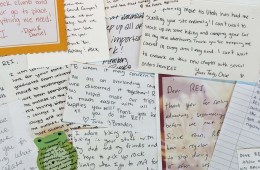 A collection of handwritten letters to REI Co-op, spread out on top of each other.