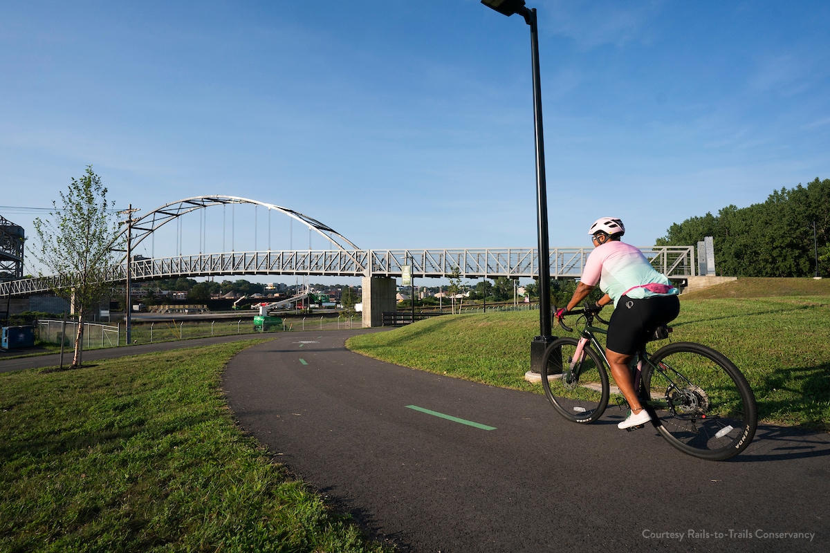 Image of a person on bike on a paved trail in Cleveland.