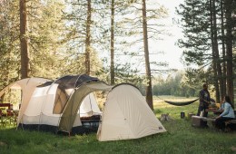 Tent and hammock in grassy campground