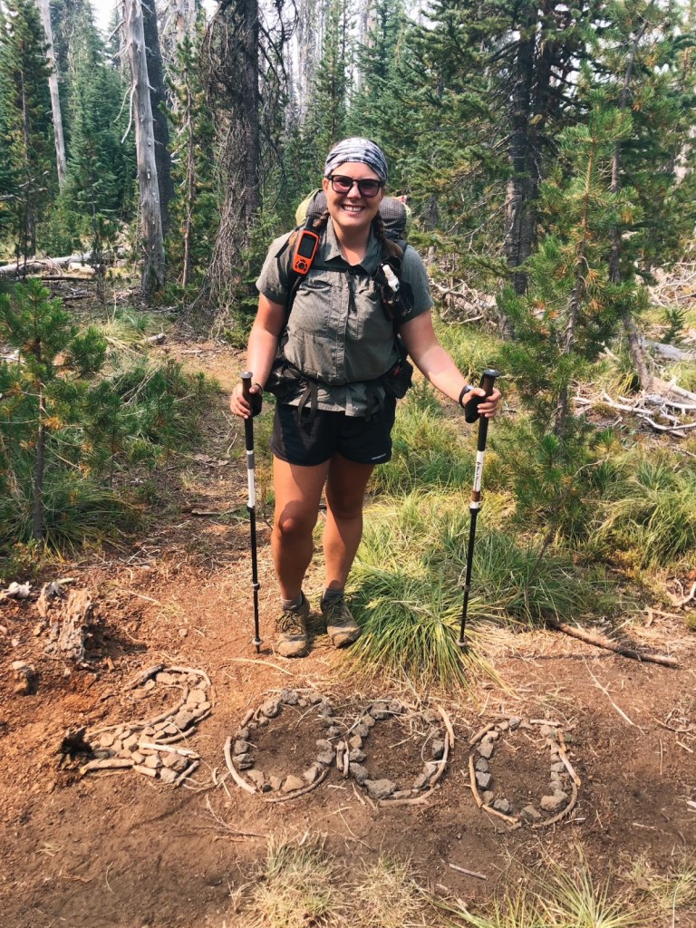 PCT hiker Emily Schrick marks her 2000th mile on the trail.