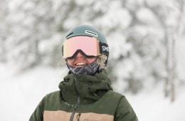 A skier wears a pair of Smith Squad MAG goggles