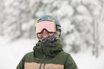A skier wears a pair of Smith Squad MAG goggles