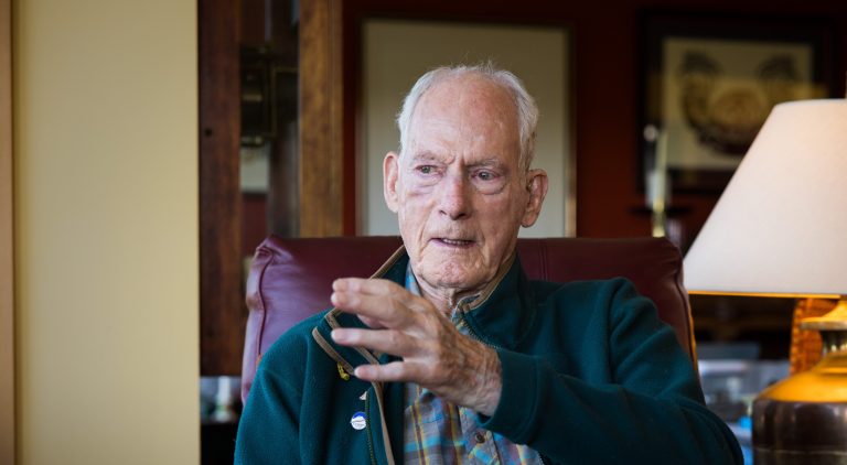 Jim Whittaker gestures as he tells more mountaineering stories in his home.
